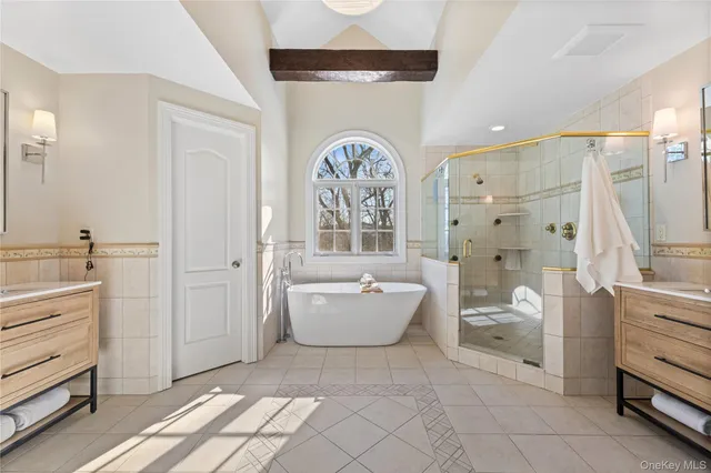 a spacious bathroom with a bathtub sink and toilet