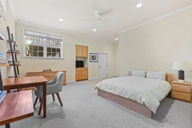 a bedroom with a large bed and a table