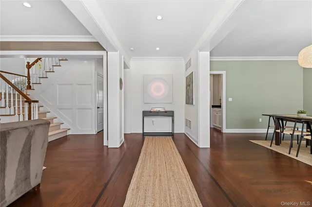 a view of a hallway view with wooden floor and staircase