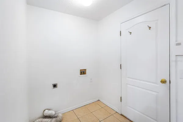 a view of kitchen with furniture and a ceiling fan