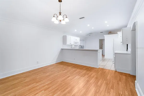 a view of a kitchen with a sink and cabinets