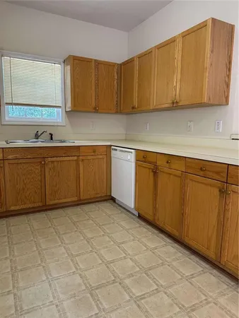 a white refrigerator freezer sitting inside of a kitchen