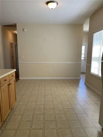 a view of an empty room with a fireplace