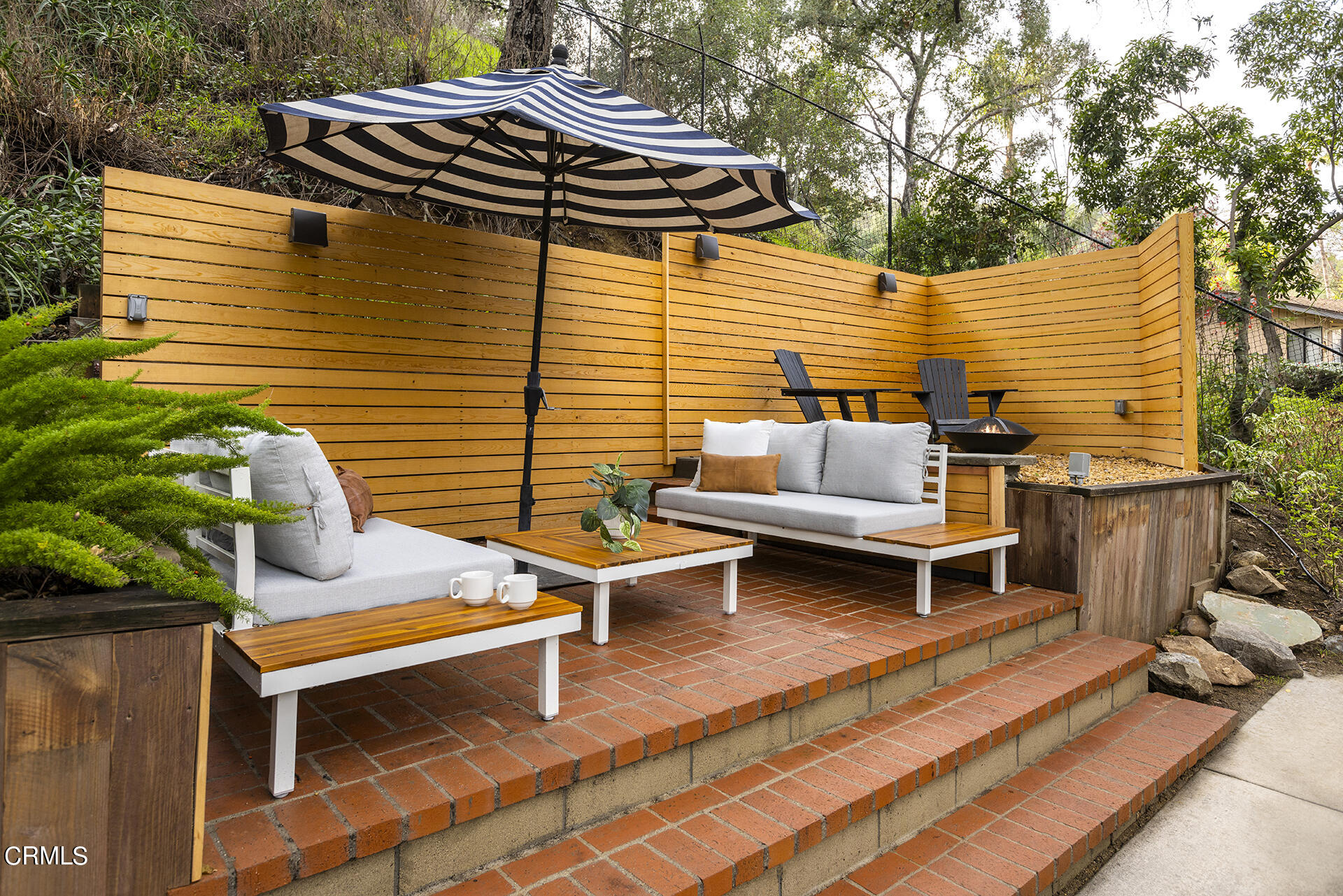 4 Lida Lane Pasadena, CA 91103 - Photo 20 of 25 a backyard of a house with outdoor seating