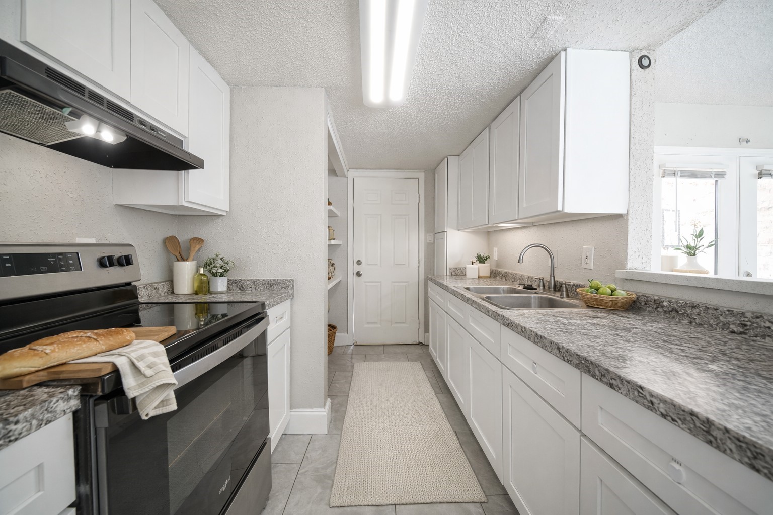 8100 Leonora Street, Unit 5 Houston, TX 77061 - Photo 4 of 11 a kitchen with a sink window and cabinets