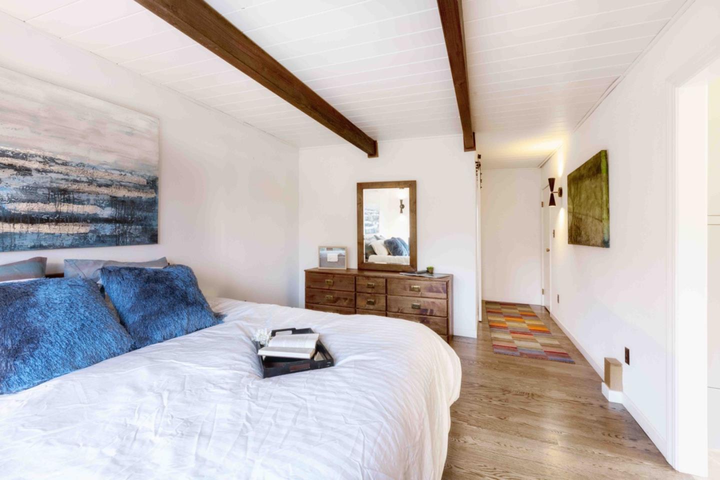 30 Ocean View Road Los Gatos, CA 95033 - Photo 13 of 40 a bedroom with a bed and wooden floor