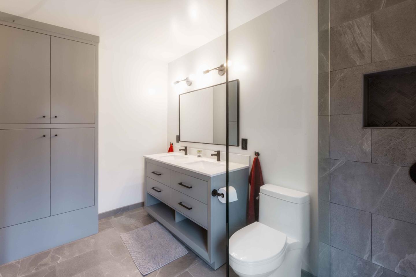 30 Ocean View Road Los Gatos, CA 95033 - Photo 14 of 40 a bathroom with a sink vanity mirror and toilet