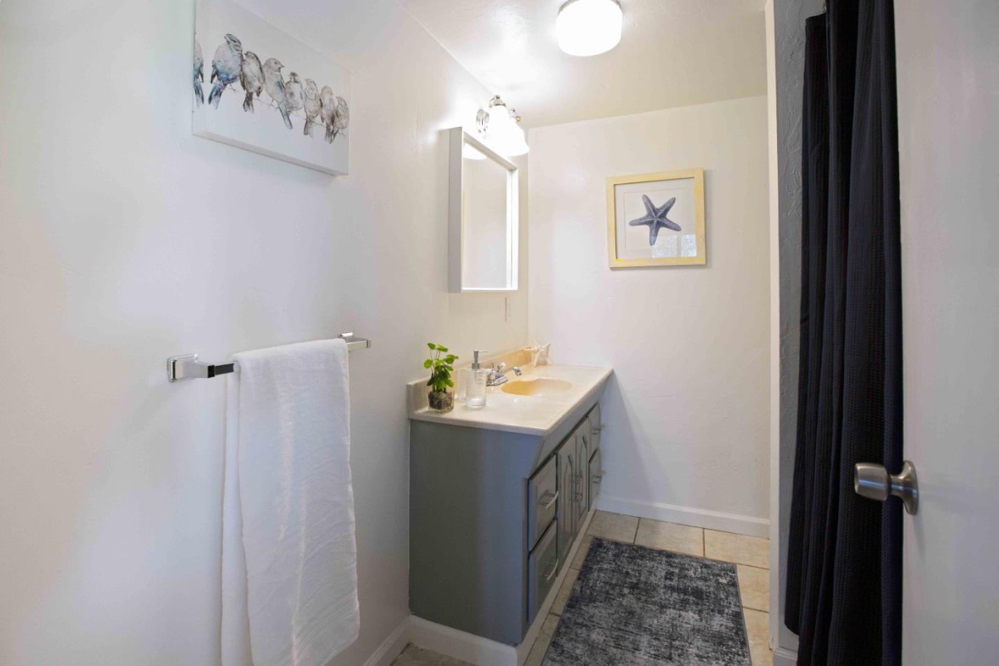 30 Ocean View Road Los Gatos, CA 95033 - Photo 25 of 40 a bathroom with a sink and mirror