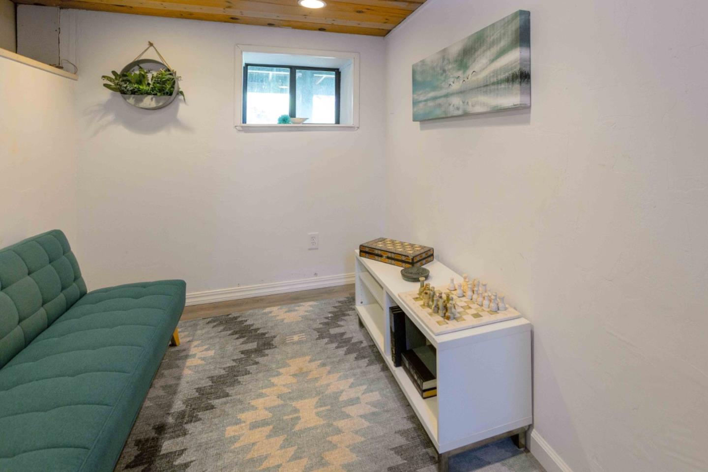 30 Ocean View Road Los Gatos, CA 95033 - Photo 26 of 40 a room with a bed and a couch