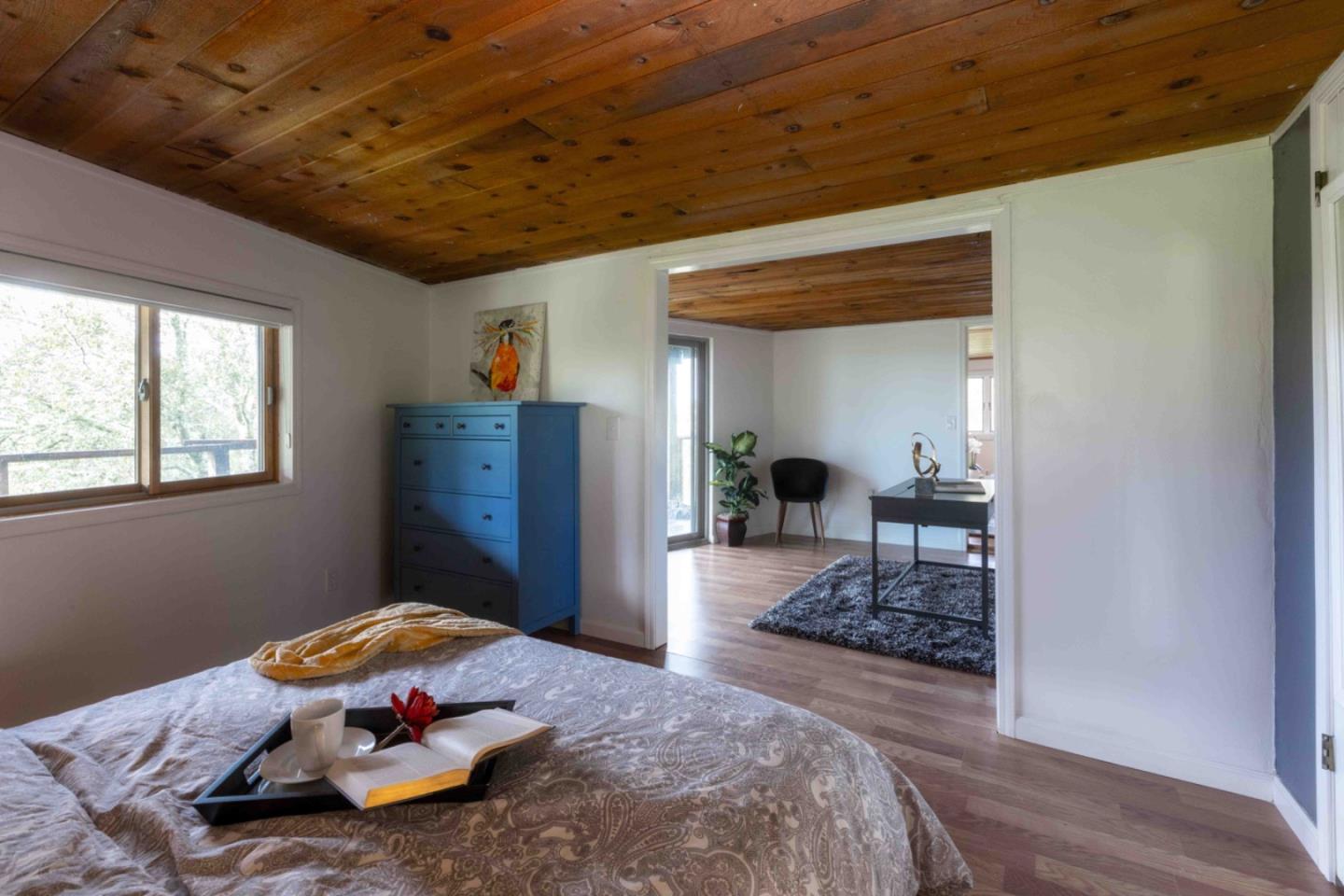 30 Ocean View Road Los Gatos, CA 95033 - Photo 27 of 40 a bedroom with a bed and wooden floor