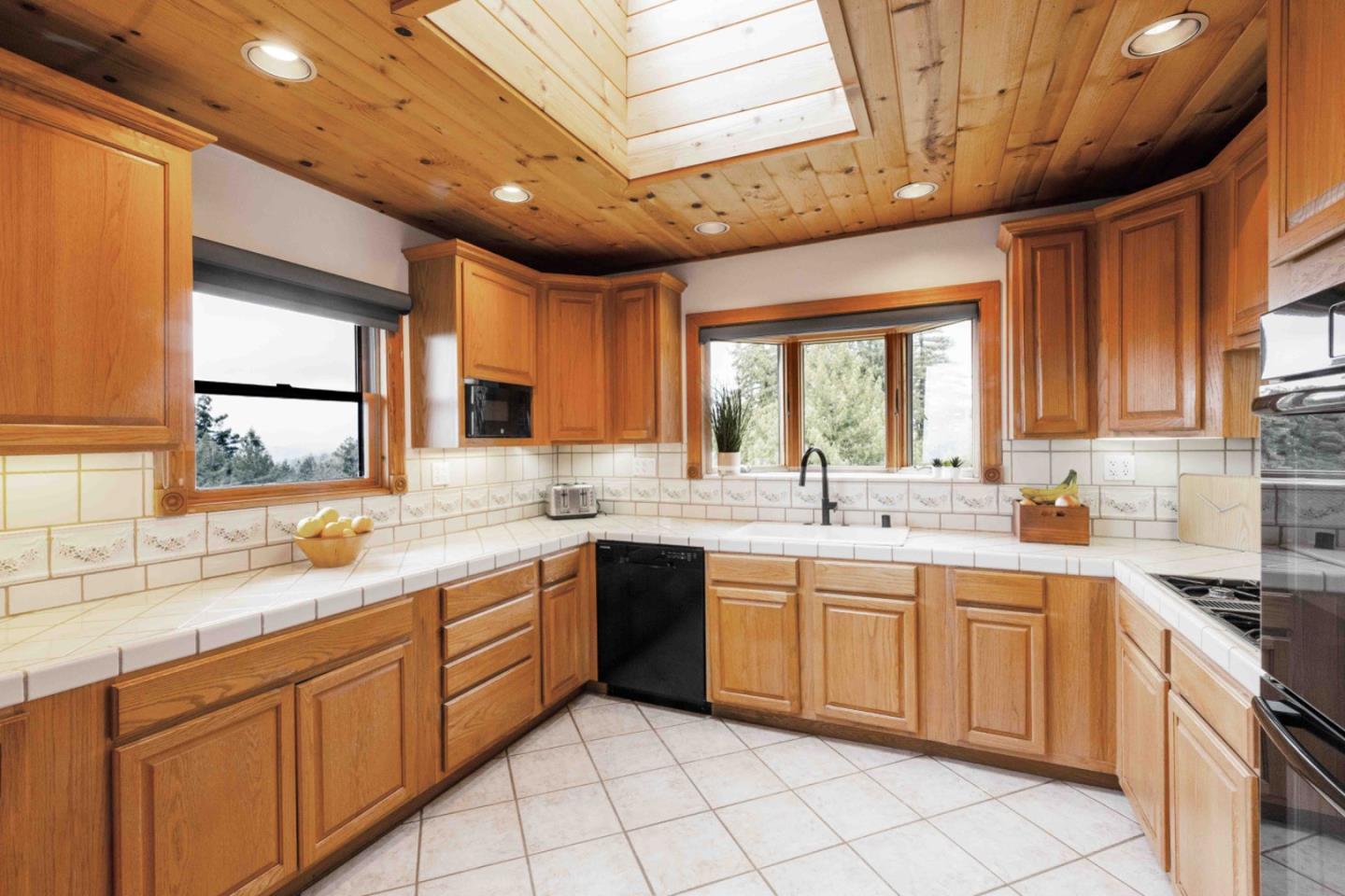30 Ocean View Road Los Gatos, CA 95033 - Photo 7 of 40 a kitchen with a sink stove and cabinets