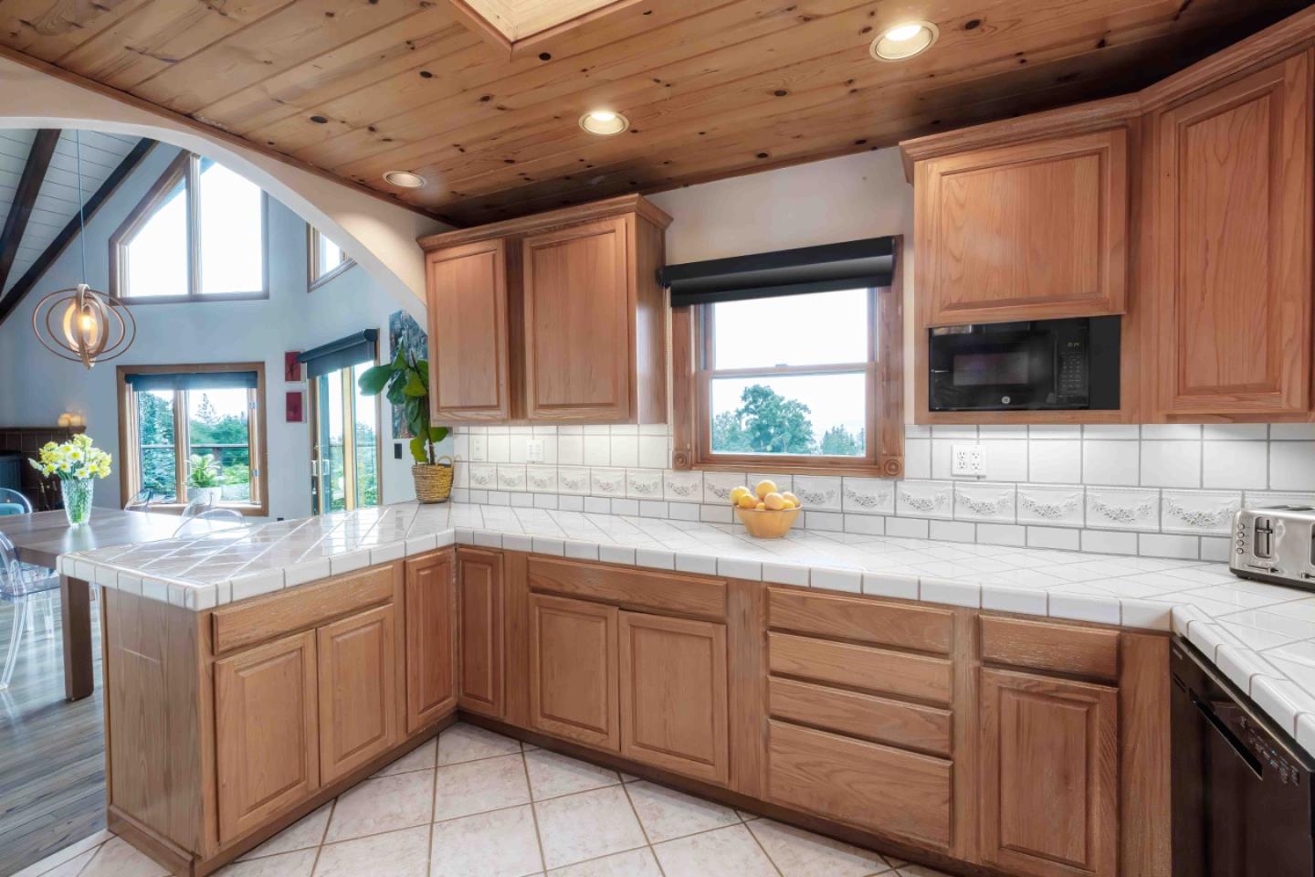 30 Ocean View Road Los Gatos, CA 95033 - Photo 8 of 40 a kitchen with a sink window and cabinets