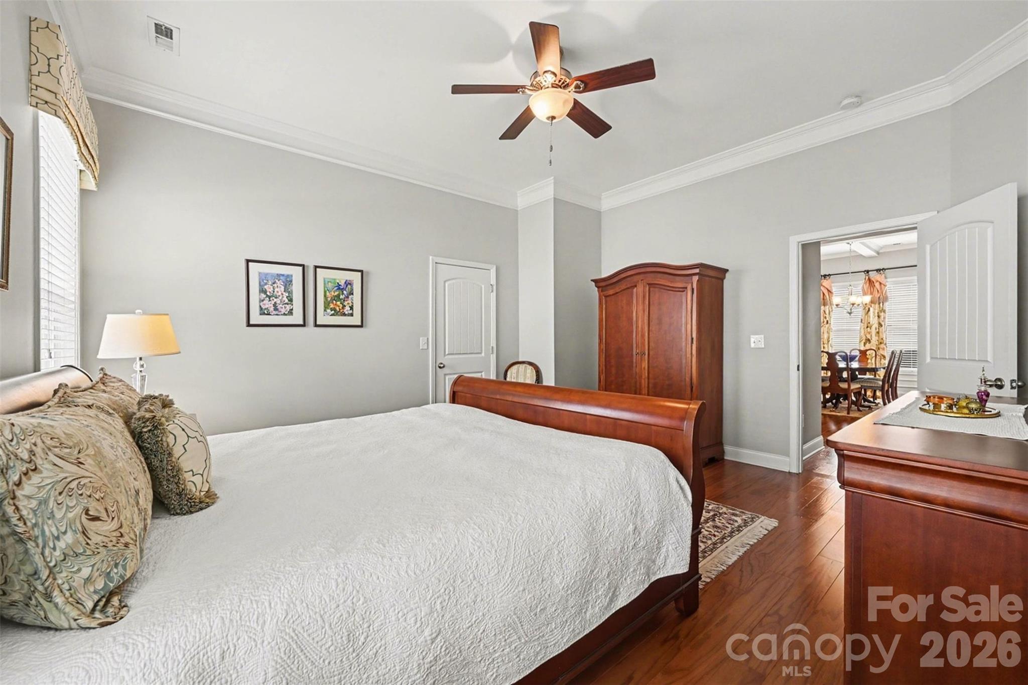 3059 Cricket Lane Lancaster, SC 29720 - Photo 20 of 32 a bedroom with a bed and a chandelier