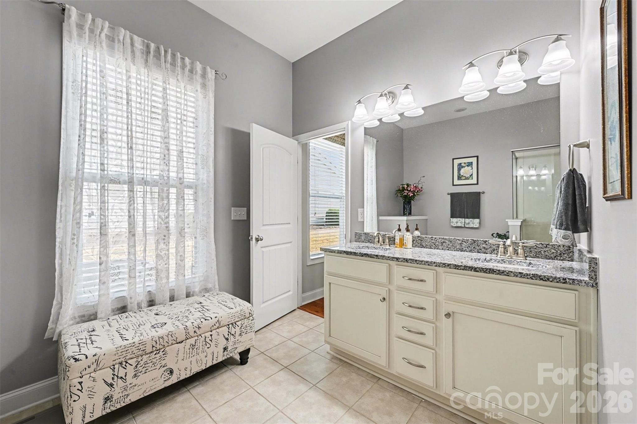 3059 Cricket Lane Lancaster, SC 29720 - Photo 21 of 32 a bathroom with a double vanity sink and a mirror