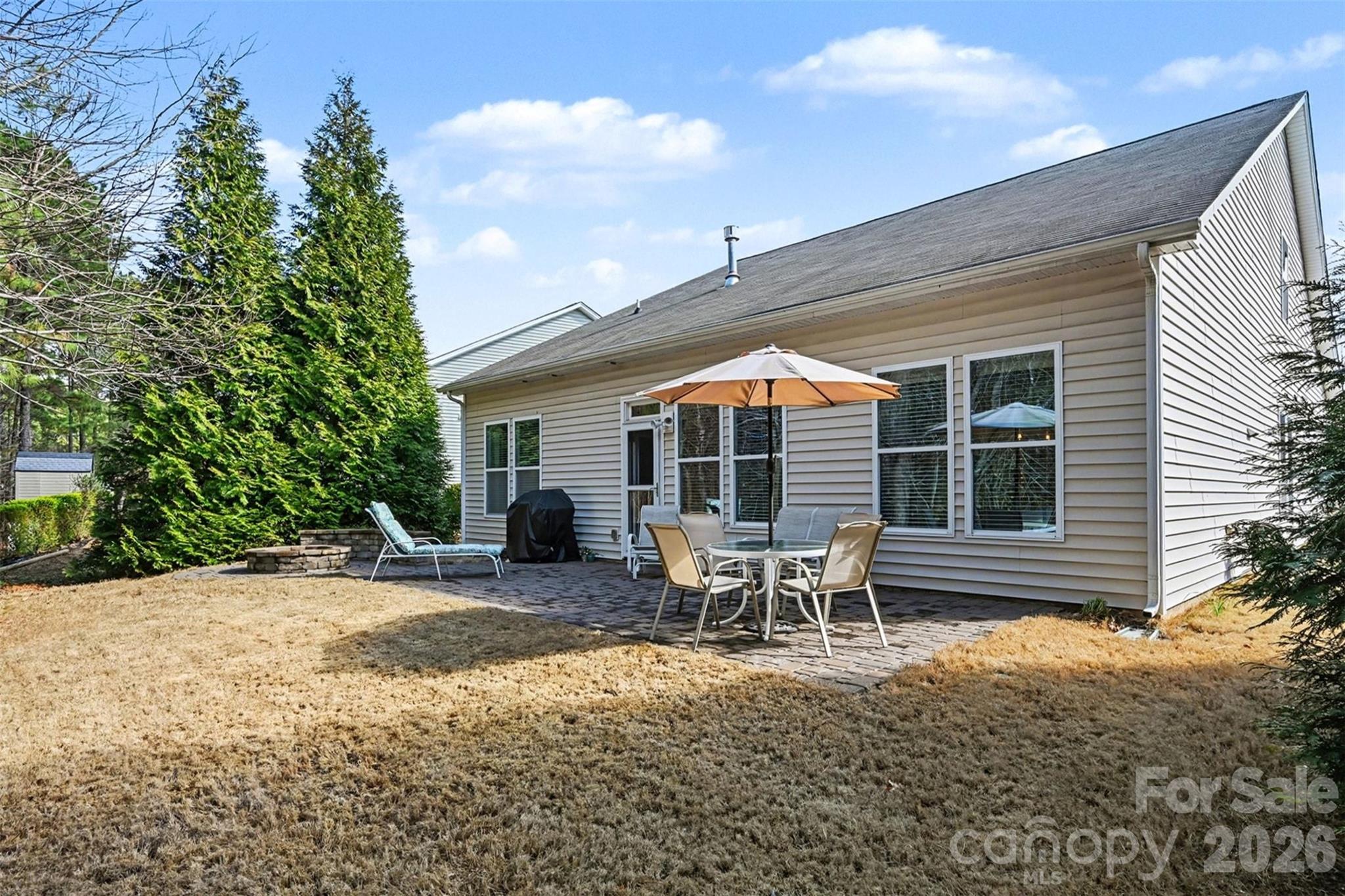 3059 Cricket Lane Lancaster, SC 29720 - Photo 26 of 32 a backyard of a house with table and chairs