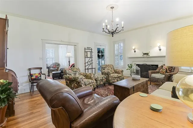 a living room with furniture chandelier and a chandelier