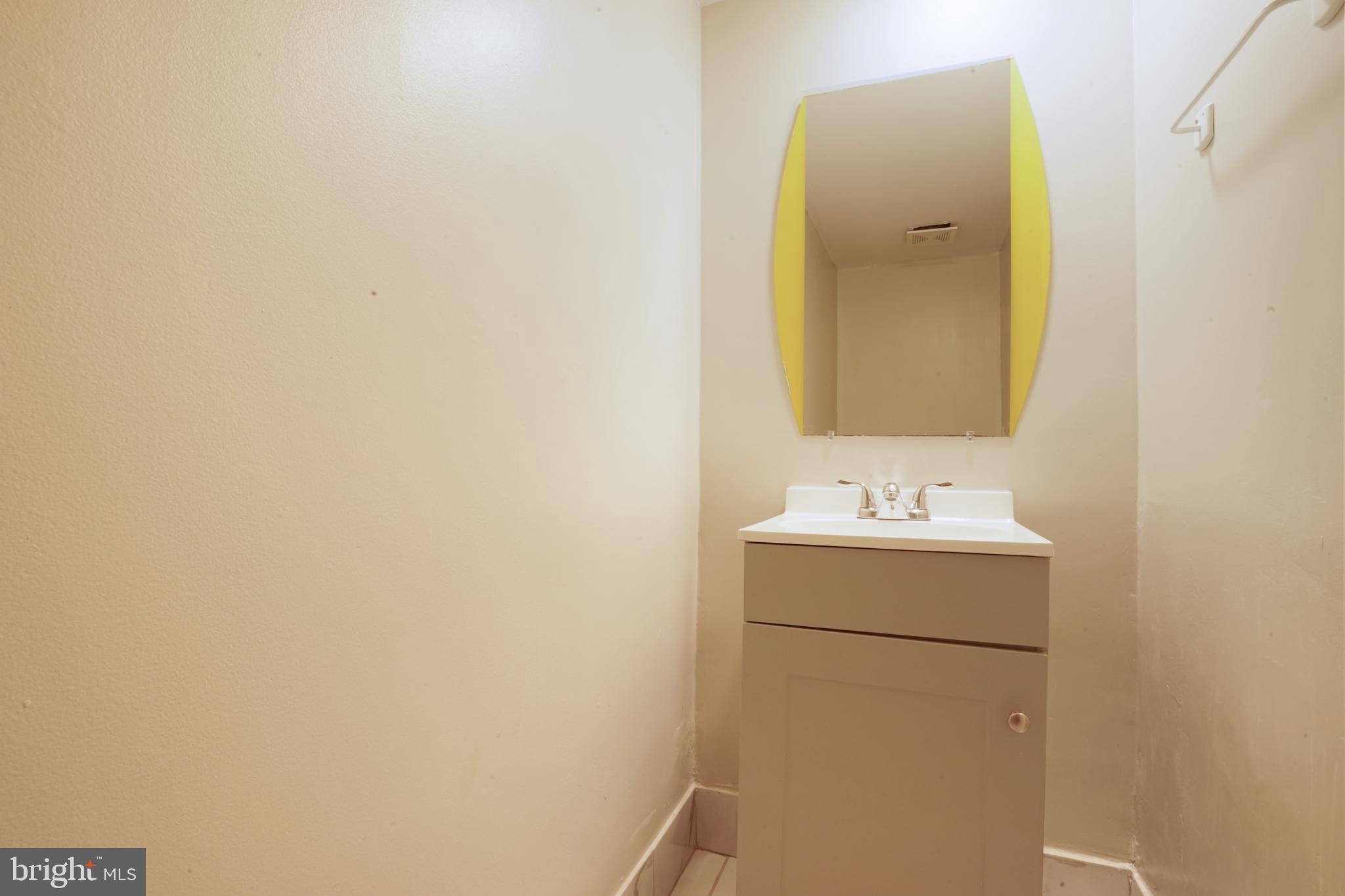 8317 Irongate Way Manassas, VA 20109 - Photo 23 of 29 a bathroom with a sink and mirror