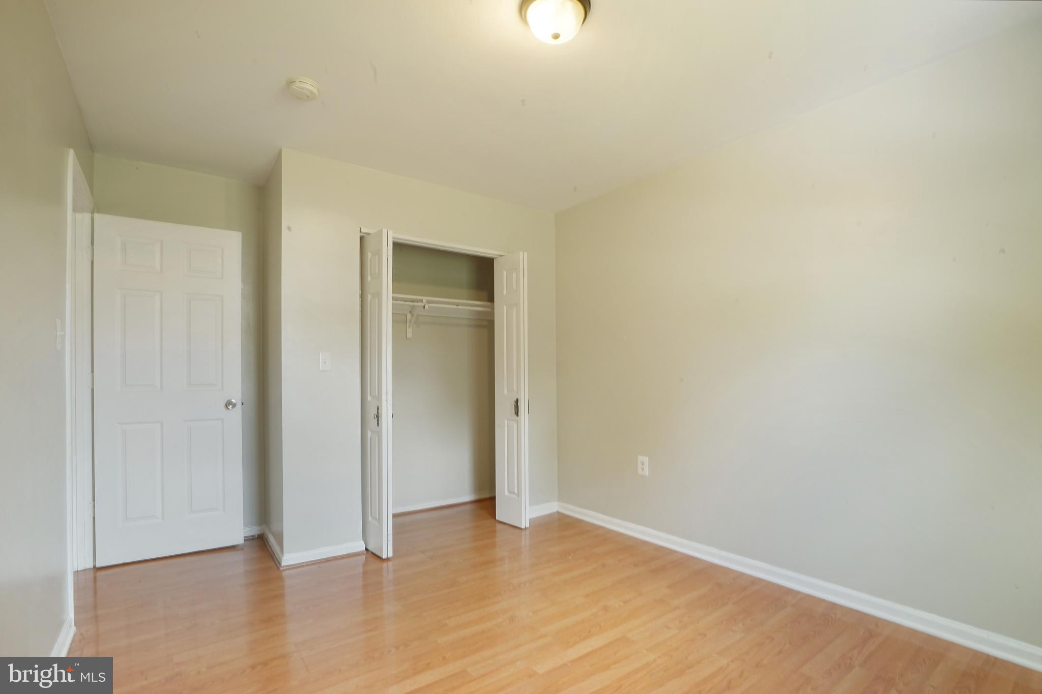 8317 Irongate Way Manassas, VA 20109 - Photo 7 of 29 a view of an empty room and wooden floor