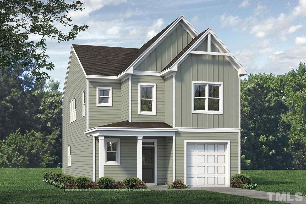 3712 Stark Road Raleigh, NC 27610 - Photo 1 of 1 a front view of a house with a yard