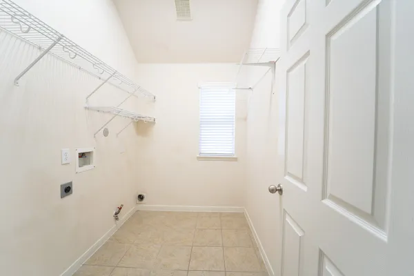 a large kitchen with kitchen island granite countertop a sink a counter top space and cabinets