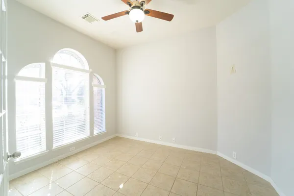 a bathroom with a sink mirror and toilet