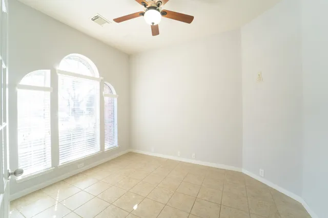 a bathroom with a sink mirror and toilet