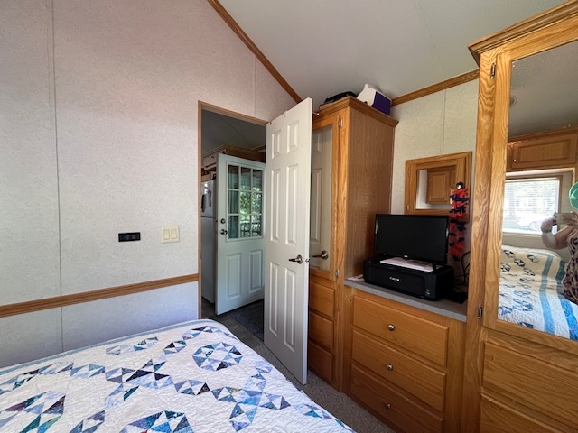 2795 East 28th Road Marseilles, IL 61341 - Photo 18 of 65 a bedroom with a bed and a flat screen tv