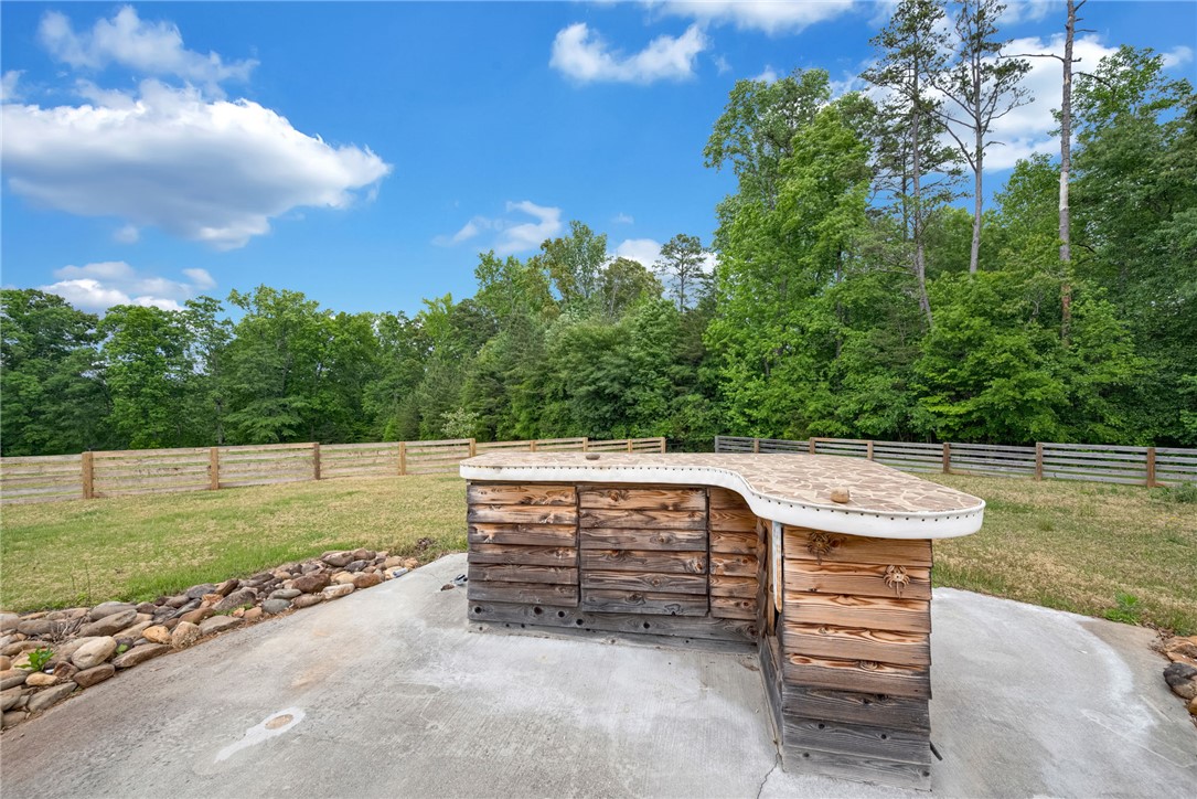 433 Latham Road Easley, SC 29640 - Photo 5 of 50 An outdoor bar and expansive green space offer ideal entertaining in a wooded setting.
