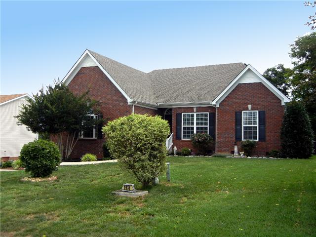 1914 Portway Road Spring Hill, TN 37174 - Photo 1 of 14 a front view of a house with a yard and garage