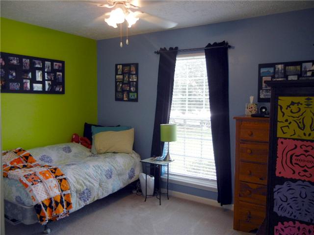 1914 Portway Road Spring Hill, TN 37174 - Photo 11 of 14 a bedroom with a bed and a window