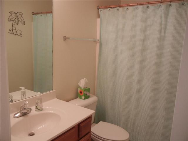 1914 Portway Road Spring Hill, TN 37174 - Photo 12 of 14 a bathroom with a sink a toilet and a mirror