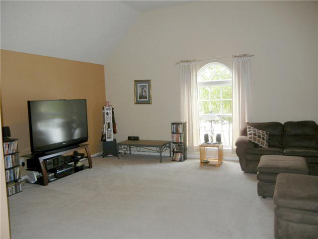 1914 Portway Road Spring Hill, TN 37174 - Photo 5 of 14 a living room with furniture and a flat screen tv