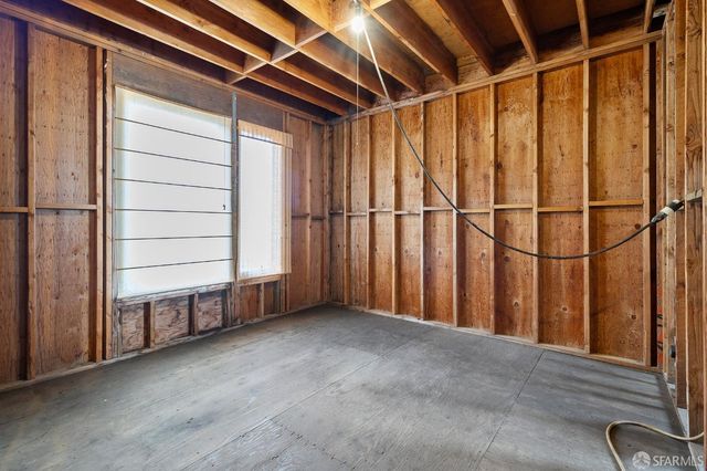 a view of a room with wooden walls