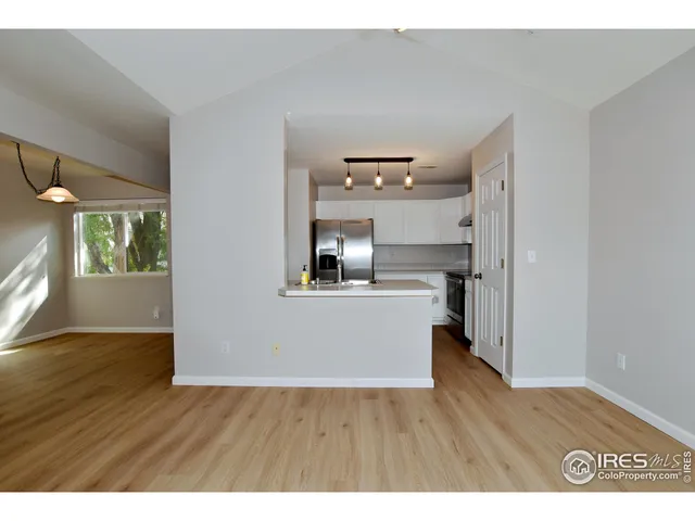 a view of kitchen with wooden floor