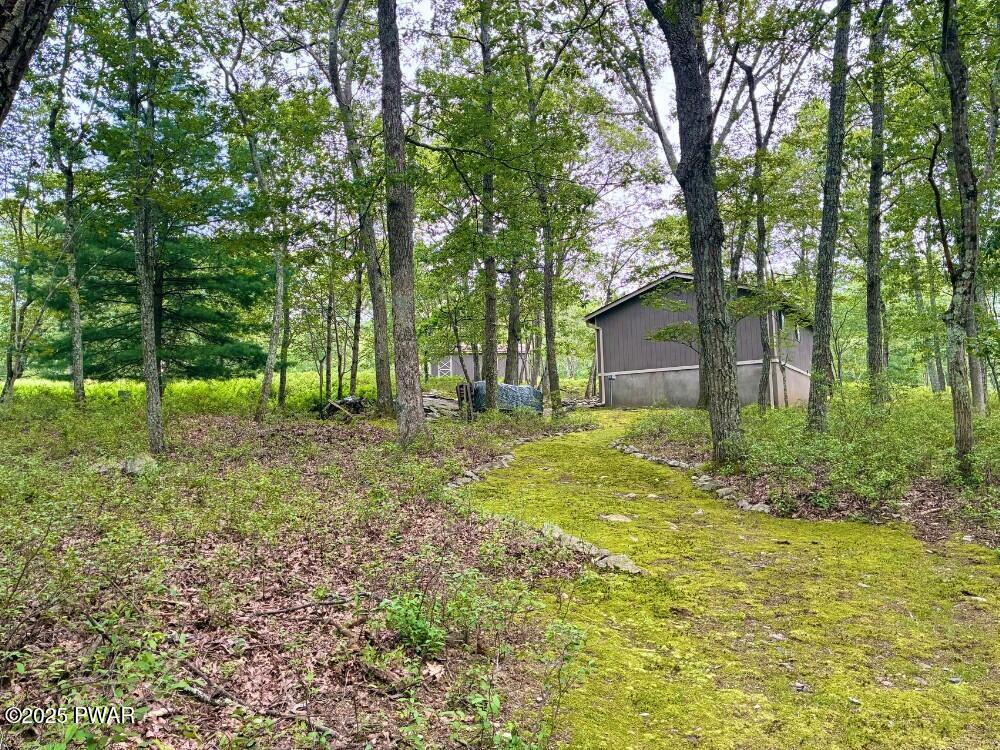 116 Maple Ridge Road Milford, PA 18337 - Photo 41 of 53 a backyard of a house with lots of green space