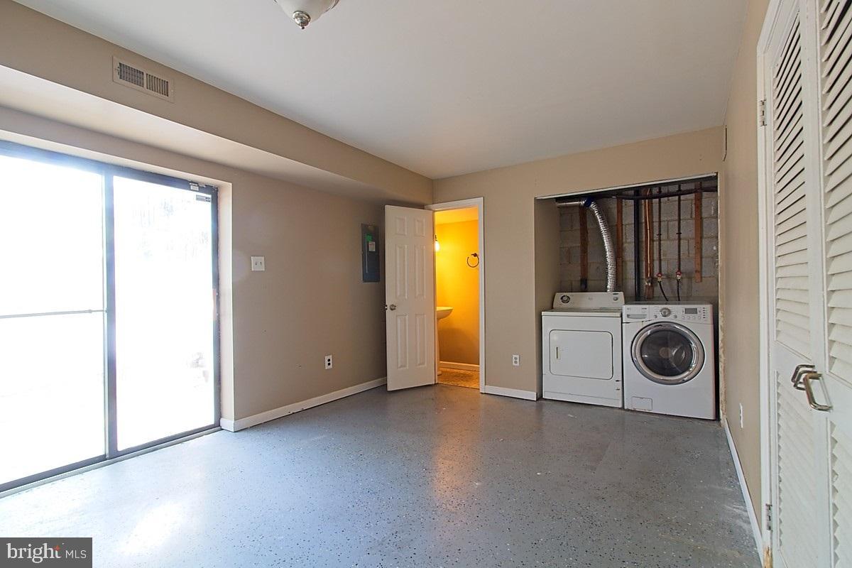 9054 Canterbury Riding, Unit 147 Laurel, MD 20723 - Photo 12 of 15 a view of a storage & utility room with washer and dryer