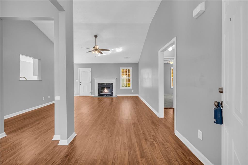 47 Chatham Court Jefferson, GA 30549 - Photo 18 of 69 a view of empty room with wooden floor and fireplace