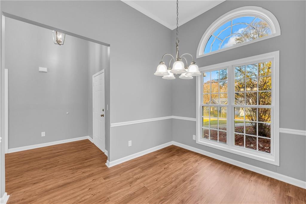 47 Chatham Court Jefferson, GA 30549 - Photo 20 of 69 a view of an empty room with wooden floor and a window