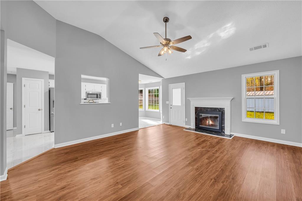 47 Chatham Court Jefferson, GA 30549 - Photo 23 of 69 a view of empty room with wooden floor and fireplace