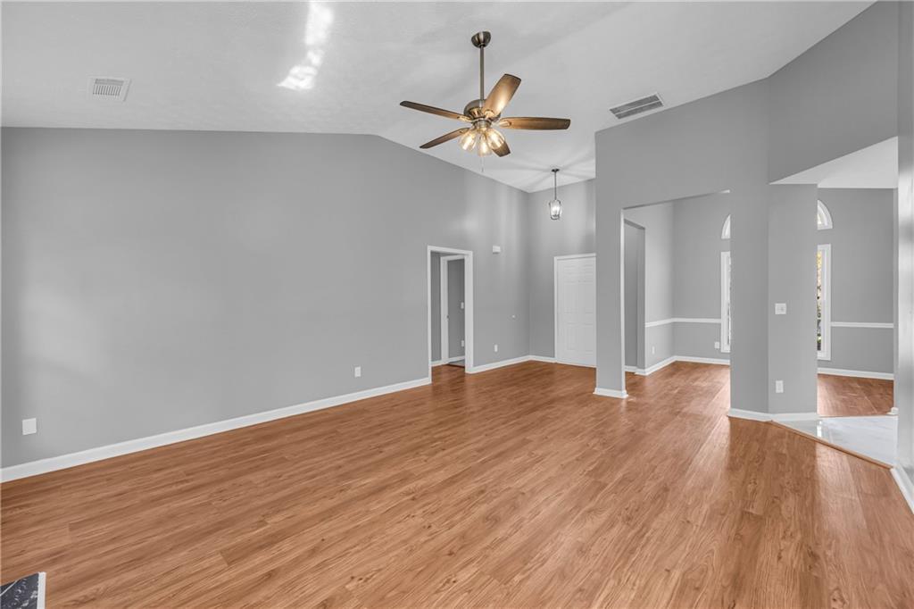 47 Chatham Court Jefferson, GA 30549 - Photo 25 of 69 a view of an empty room with wooden floor and a ceiling fan