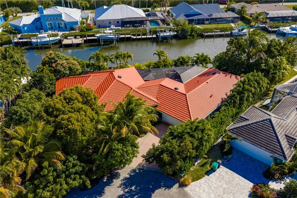 an aerial view of a house with outdoor space lake view and boat