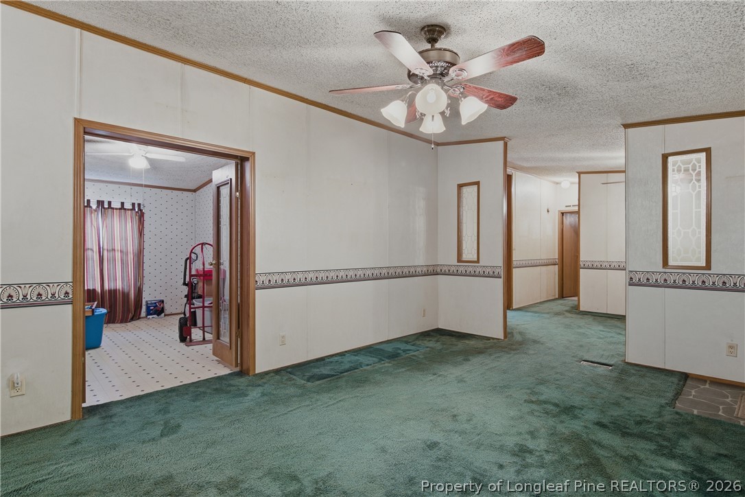 7307 Roslin Farm Road Hope Mills, NC 28348 - Photo 11 of 46 a view of a livingroom with a ceiling fan