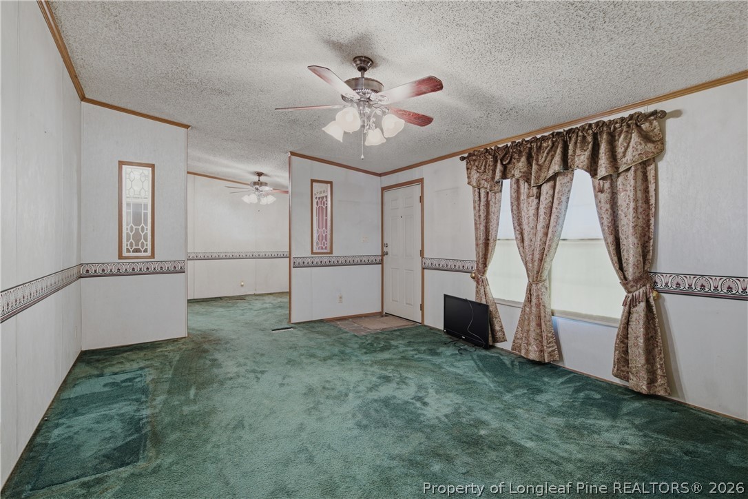 7307 Roslin Farm Road Hope Mills, NC 28348 - Photo 12 of 46 a view of empty room with wooden floor and fan