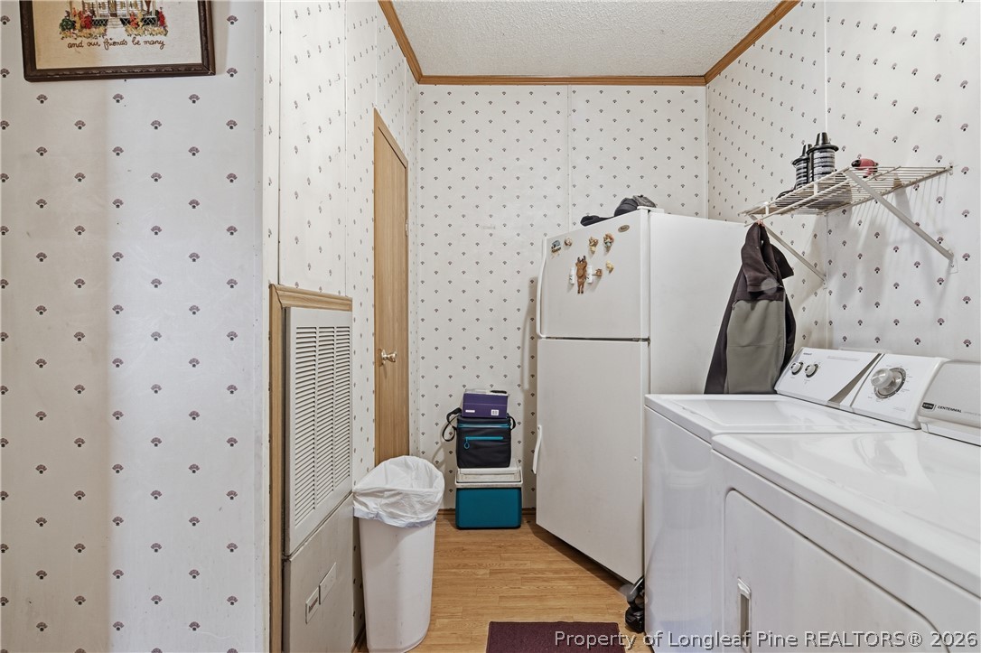 7307 Roslin Farm Road Hope Mills, NC 28348 - Photo 23 of 46 a utility room with dryer and washer