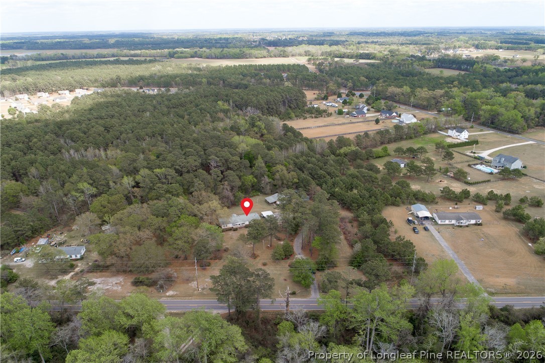 7307 Roslin Farm Road Hope Mills, NC 28348 - Photo 3 of 46 a view of a lake with a mountain in the background