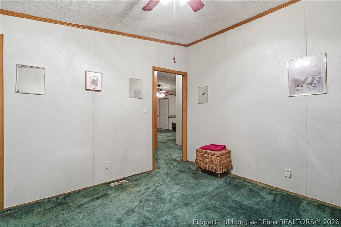 7307 Roslin Farm Road Hope Mills, NC 28348 - Photo 33 of 46 a bedroom with a bed and a window