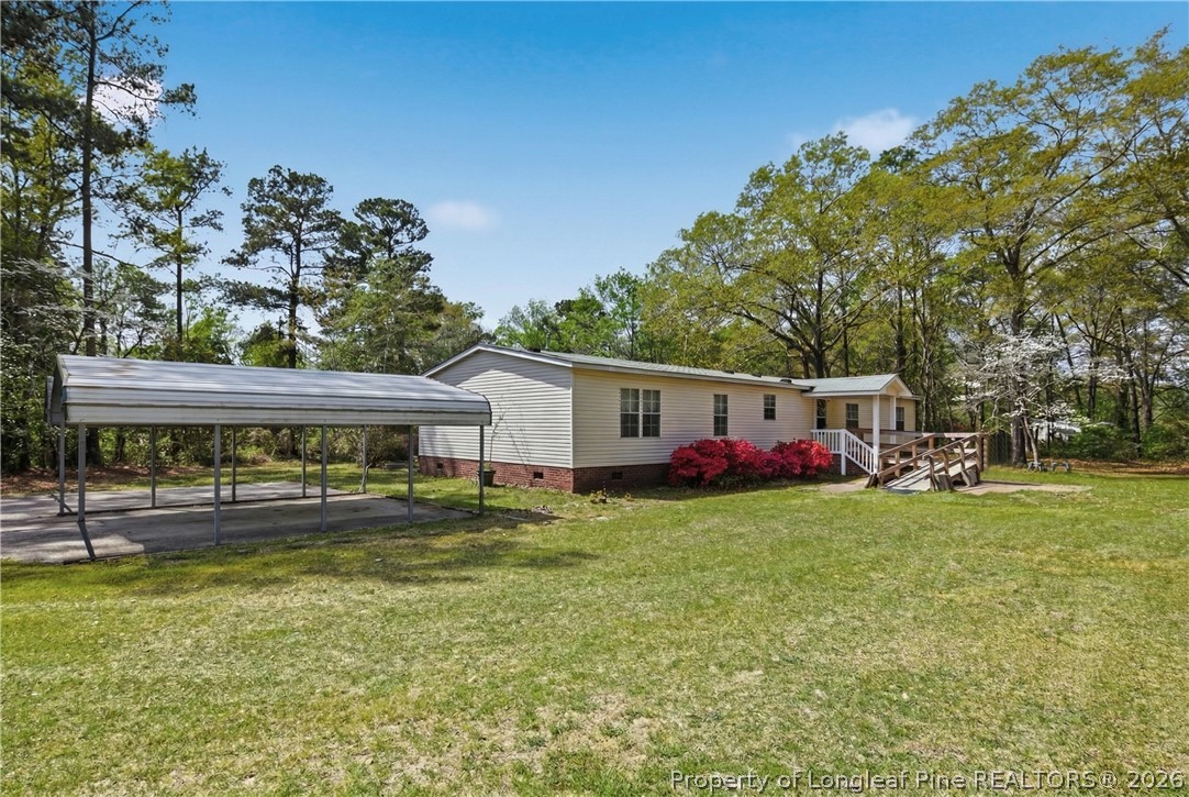 7307 Roslin Farm Road Hope Mills, NC 28348 - Photo 36 of 46 a view of a house with a back yard