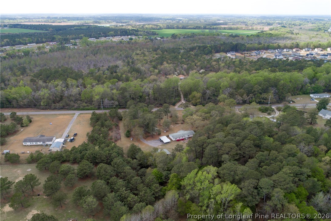 7307 Roslin Farm Road Hope Mills, NC 28348 - Photo 42 of 46 an aerial view of mountain with trees all around