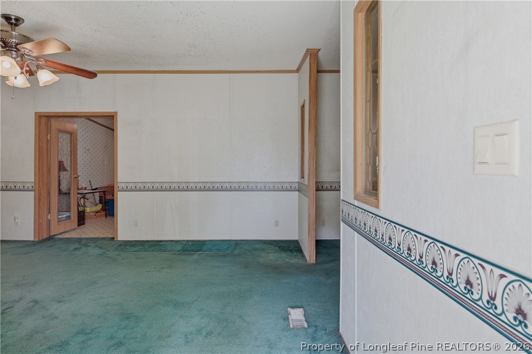 7307 Roslin Farm Road Hope Mills, NC 28348 - Photo 7 of 46 a view of a room with rack on the wall