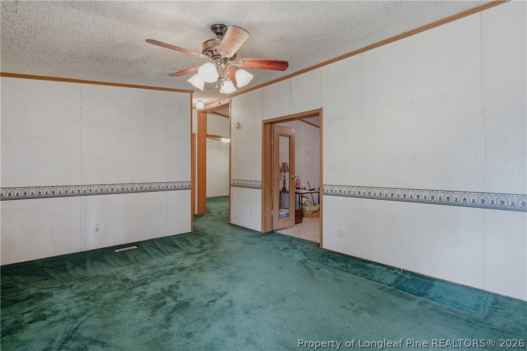 7307 Roslin Farm Road Hope Mills, NC 28348 - Photo 8 of 46 a view of a livingroom with a ceiling fan and window